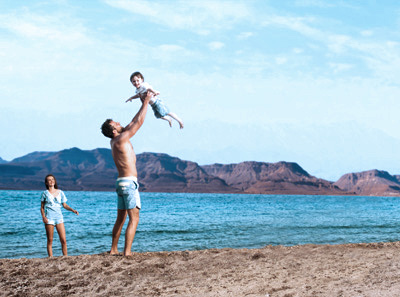 Couple with baby at the beach